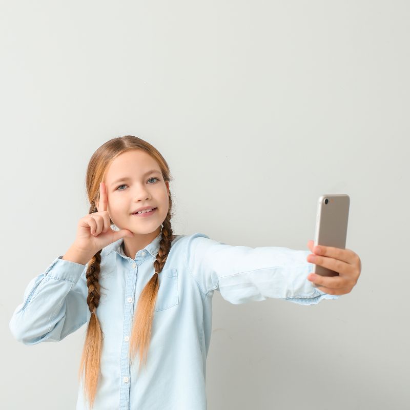 young girl taking a selfie