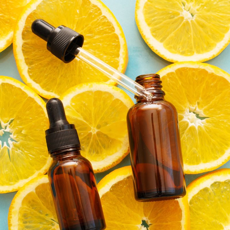 Image of oils on a bed of orange slices.