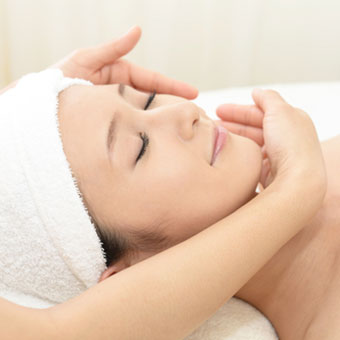 Dry cleansing being performed on a client to prep the skin for treatment.