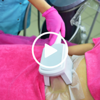 Esthetician performing CoolSculpting — fat freezing, fat reduction with play button overlay 