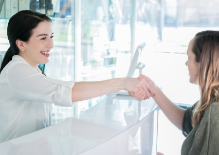 Client shaking esthetician's hand