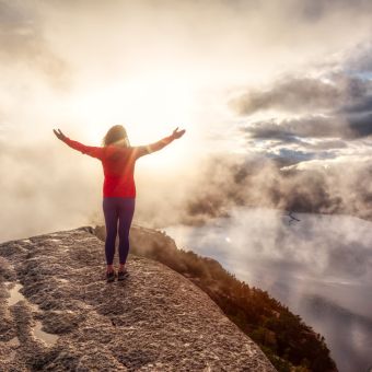 Woman Standing on a mountain