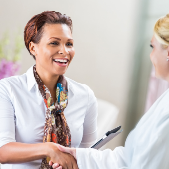 Esthetician greeting her client
