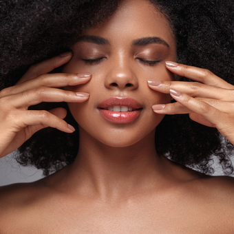 woman standing behind a leaf