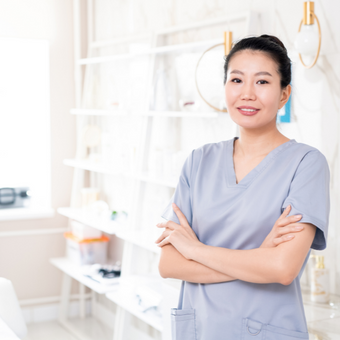 Esthetician standing in her spa